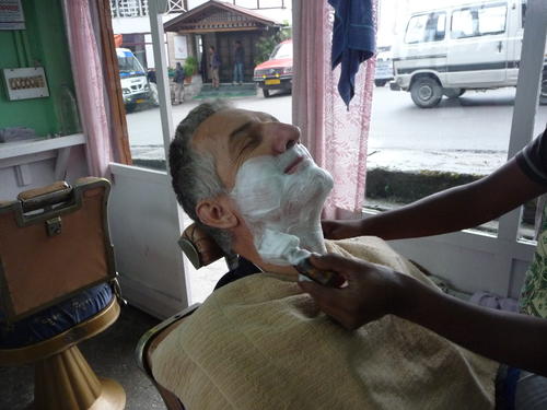 David getting a shave in Gangtok.  A shave in India is one of the best deals in the world.  $.50 or so.