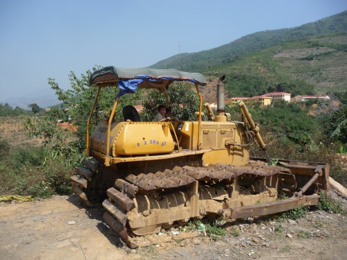 P1050919 Think kids don't have neat stuff to play with in Vietnam. Think again. How abour a 40 ton tractor