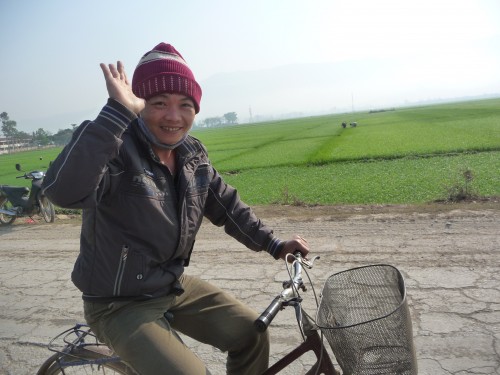P1050960 This guy rode next to me for 15 minutes on the way out of Dien Bien Phu. We "talked" the whole time. That doesn't mean either of us understood much of anything. He did get that I was head to Laos and was from the US. Very friendly. It was fun.
