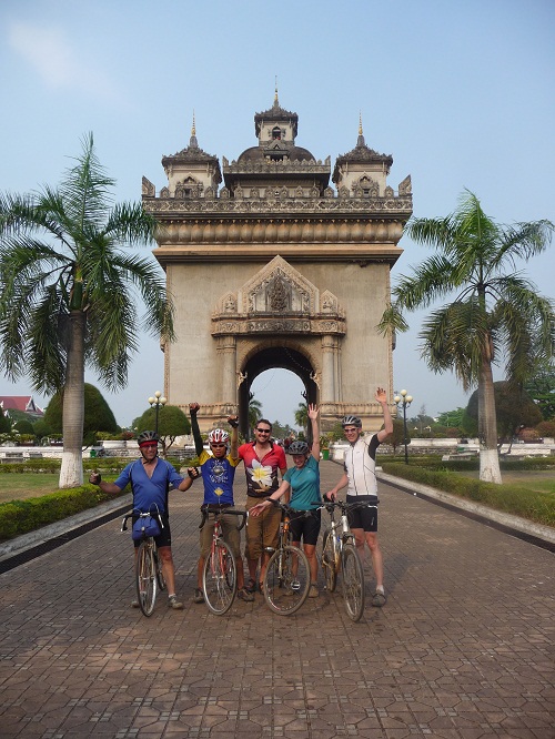 Triumpant entry into Vientiane.  That is a gift from the French in 1904 behind us.